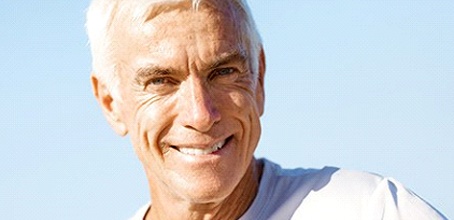 Smiling man with dental implant supported dentures in Boca Raton