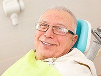 older man smiling in the dental treatment chair