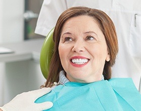 Older woman smiling in dental chair