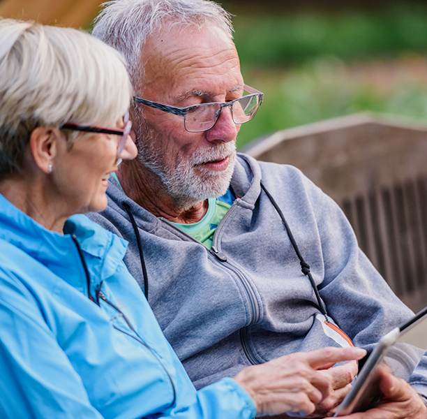 Senior couple looking at a tablet together