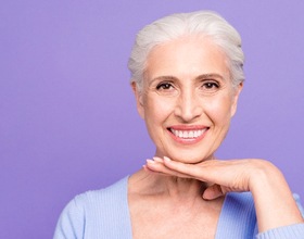 Senior woman with beautiful teeth smiling after dental bonding