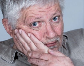 Closeup of senior man with facial pain before bruxism treatment