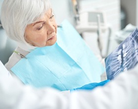 Woman talking about dental bridges during dental consultation