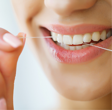 Person flossing their teeth