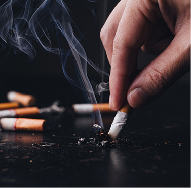 Person putting out a cigarette