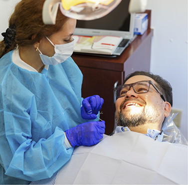 Man smiling at his dental hygienist