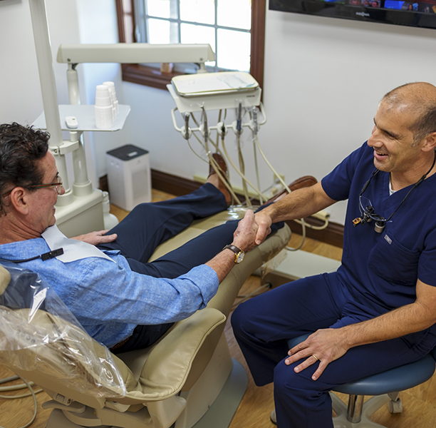 Doctor Lamberti shaking hands with a patient