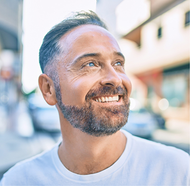 Smiling man in a white tee shirt