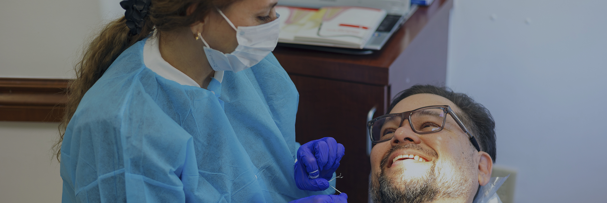 Man smiling at his dental hygienist before getting dental sealants