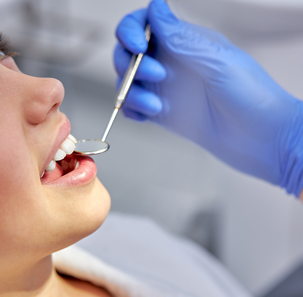 Dentist examining a patient's teeth