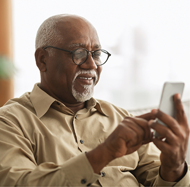 Senior man scrolling on his phone
