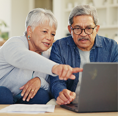 Senior couple using a laptop