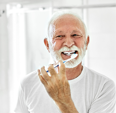 Senior man brushing his teeth