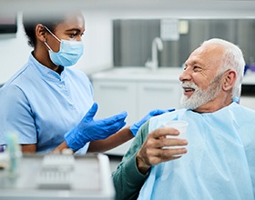 Dentist and patient discussing dentures in Boca Raton