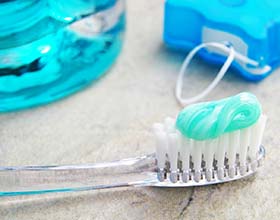 Closeup of toothbrush and toothpaste to prevent dental emergencies in Boca Raton