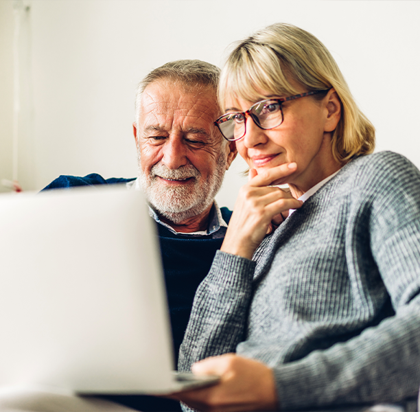 Older couple looking at a laptop together
