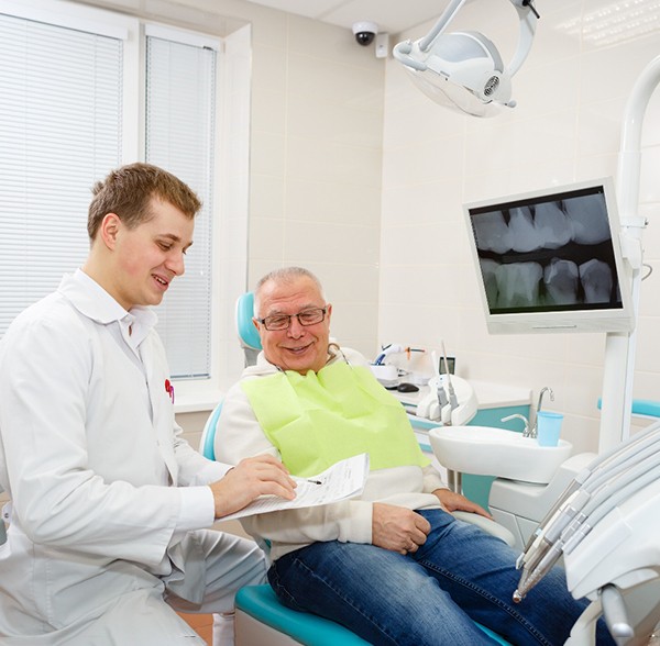 Man smiling at the dentist