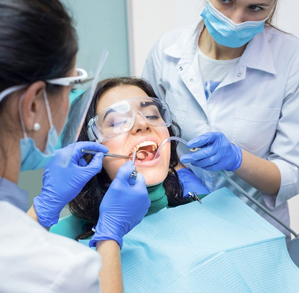 Women getting a dental procedure. 