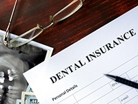 Dental insurance paperwork for the cost of dental implants in Boca Raton 