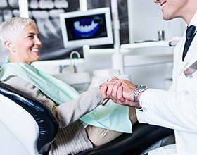 elderly woman at a dental implant consultation