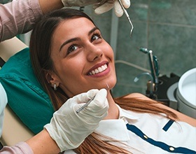 Woman receiving oral cancer screening