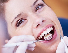 Woman receiving dental sealants