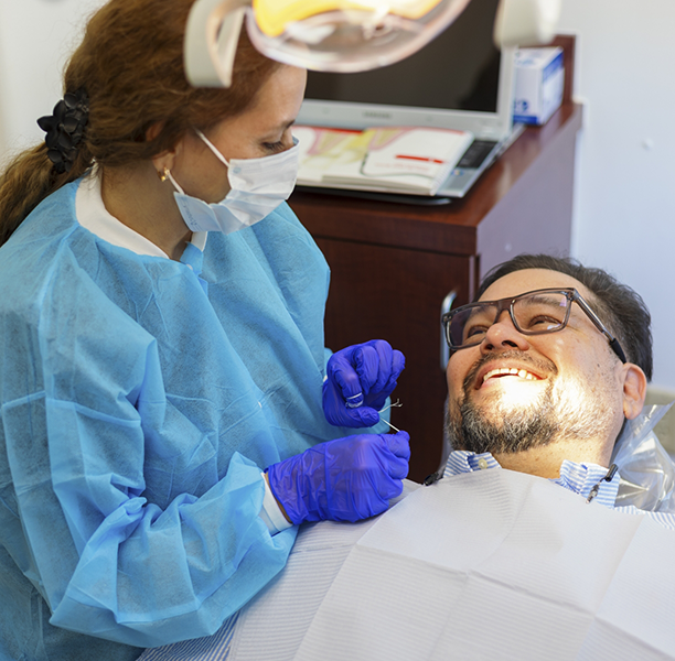 Man smiling at his dental hygienist