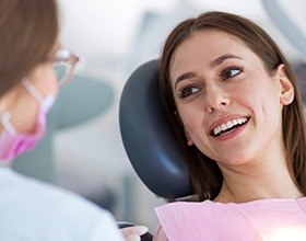 Smiling woman with partial dentures