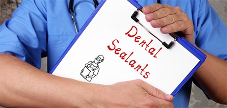 Dentist holding a clickboard