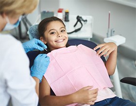 Girl smiling at the dentist