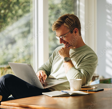 Man reading on his laptop