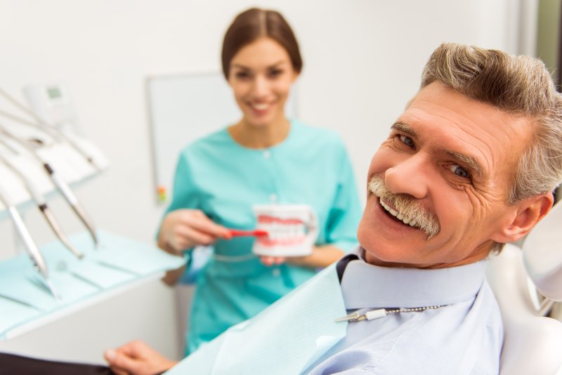 Man smiling at dentist's office.