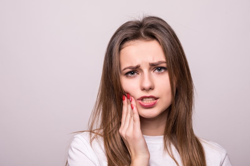young woman with teeth sensitivity in Boca Raton