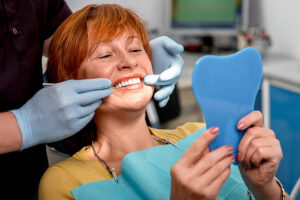 Woman in dentist’s chair for dentures
