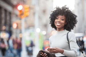 Woman smiling brightly while out on the town