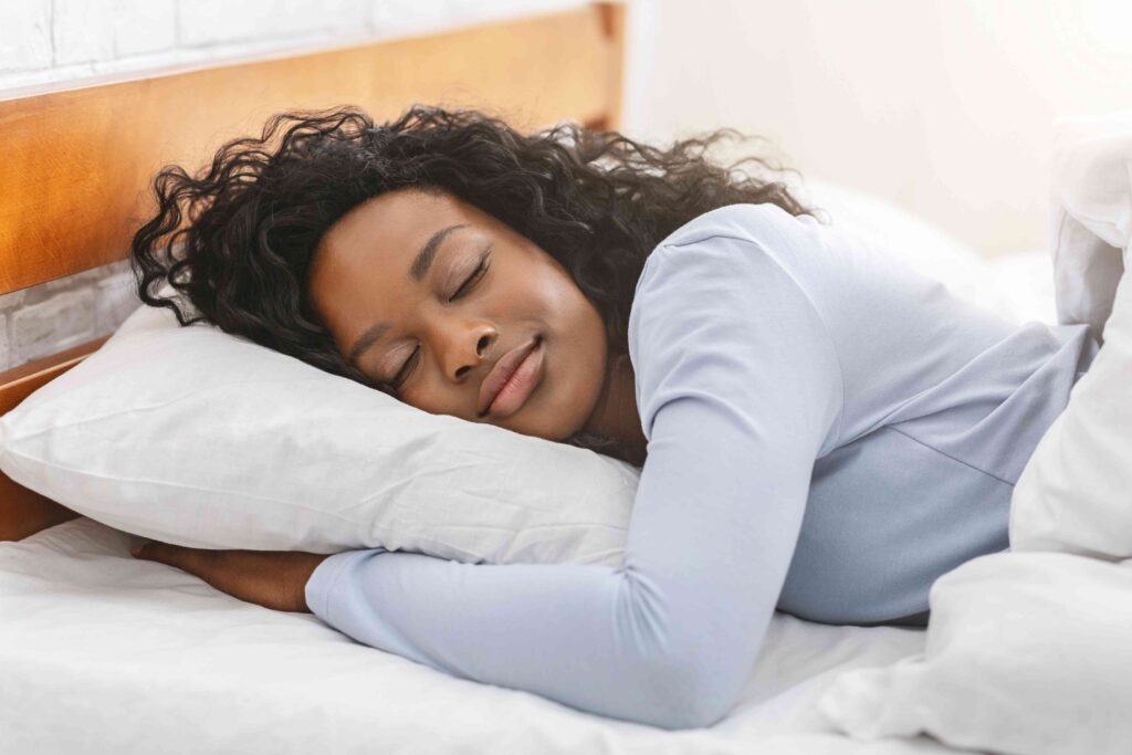 Woman resting in a bed